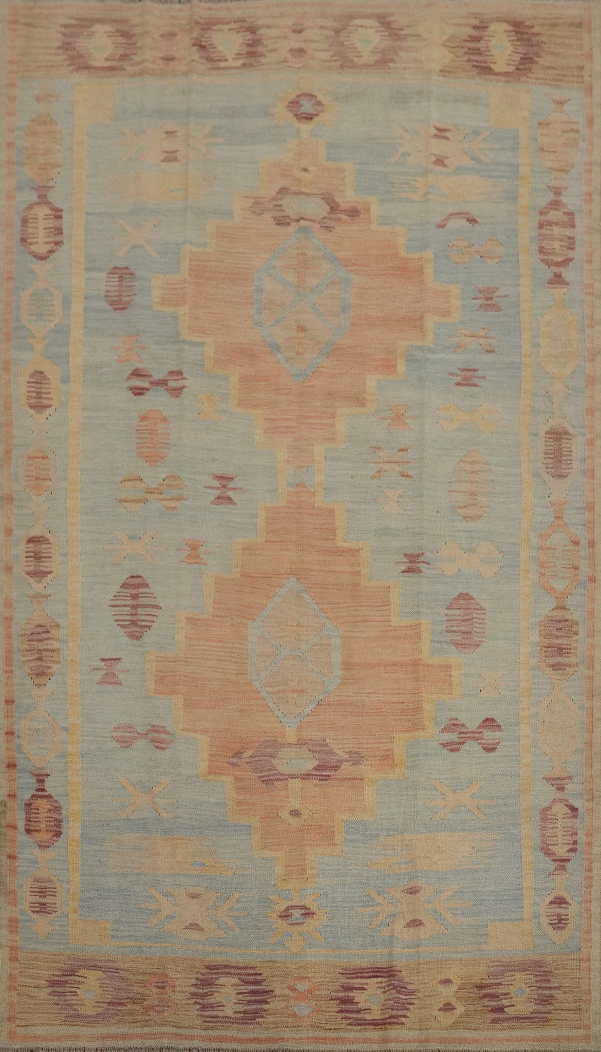 Soft Tones and Geometric Patterns in a Vintage-Style Rug 5x8